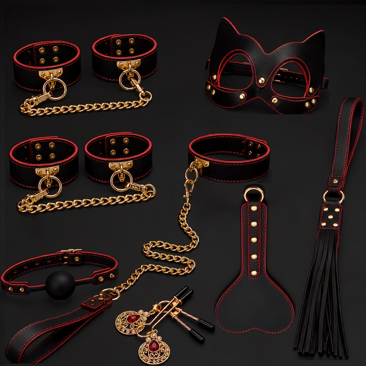 Flat lay of the Eclipse Ritual red and black 10-piece bondage kit with cuffs, collar, mask, gag, paddle, flogger, clamps and gold-tone hardware.