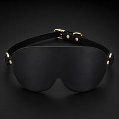 Front view of the Midnight Veil contoured black PU leather eye mask with an adjustable satin-touch band.
